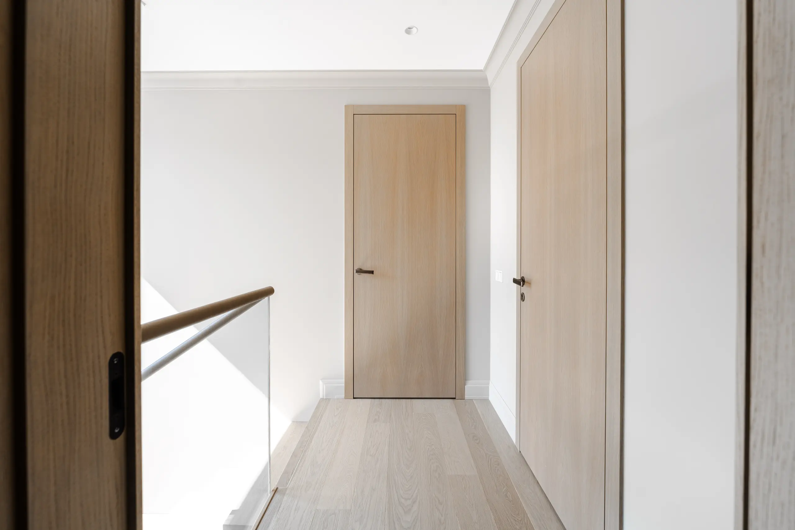 Minimal oak doors and architectural joinery in a bright private residence